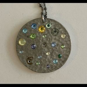 Silver pendant necklace with blue, green, and yellow stones